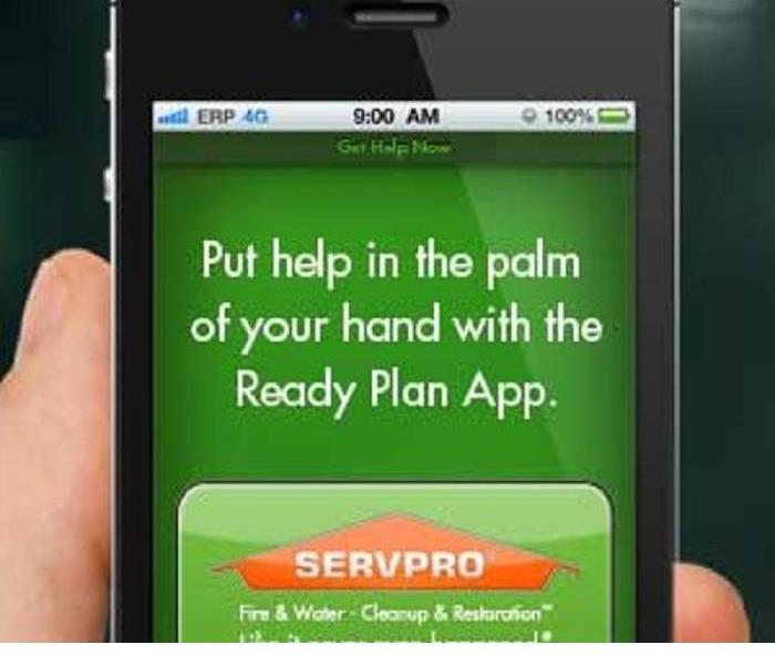A hand is shown holding a cellphone on the screen is information about Ready Plan app