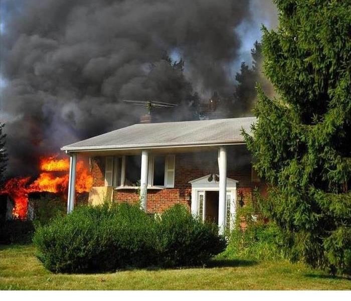 A home that is in flames is shown 